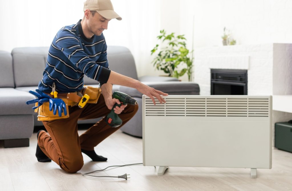 person cleaning electric component